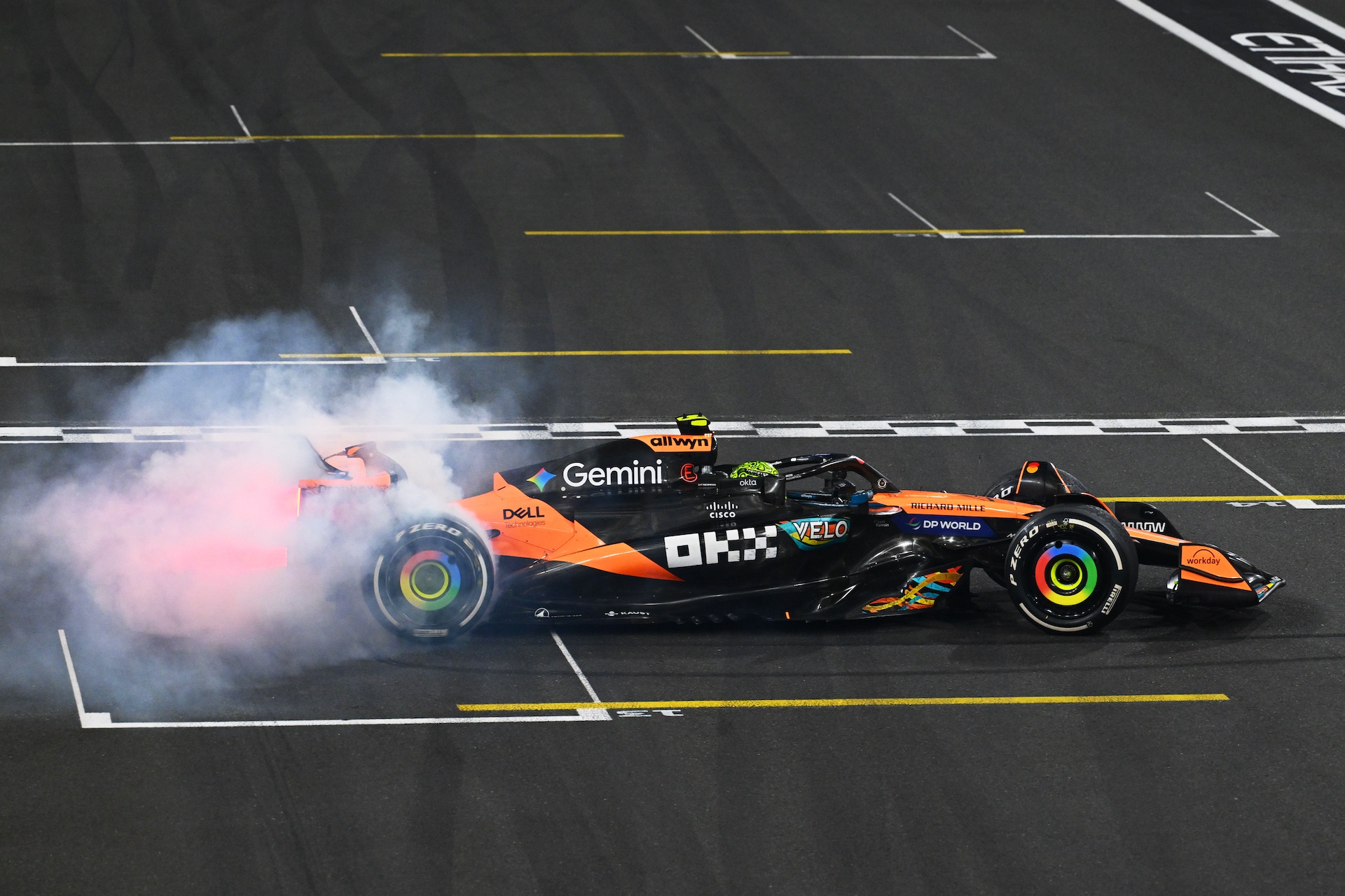 ABU DHABI, UNITED ARAB EMIRATES - DECEMBER 07: 2025 F1 World Drivers Champion and Third placed Lando Norris of Great Britain driving the (4) McLaren MCL39 Mercedes performs donuts in celebration during the F1 Grand Prix of Abu Dhabi at Yas Marina Circuit on December 07, 2025 in Abu Dhabi, United Arab Emirates. (Photo by Mark Sutton - Formula 1/Formula 1 via Getty Images)